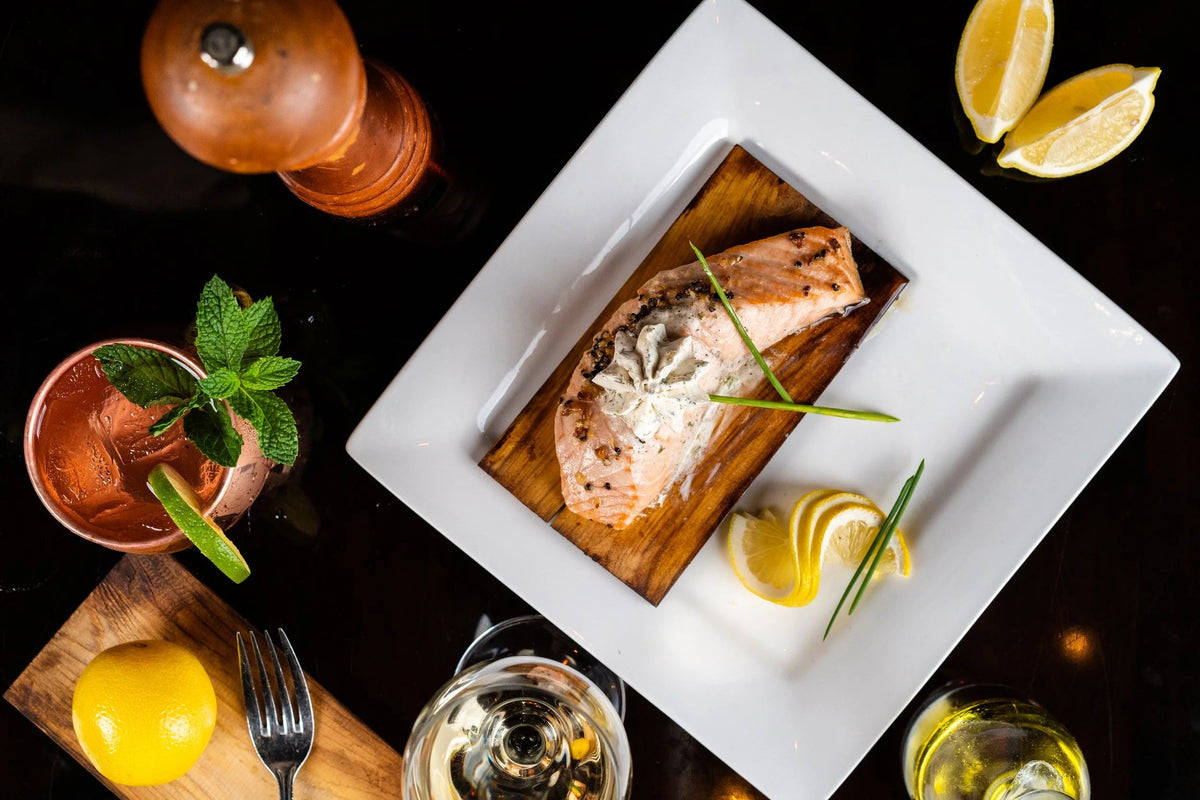 A plated entree with cocktails at Friar Tuck's